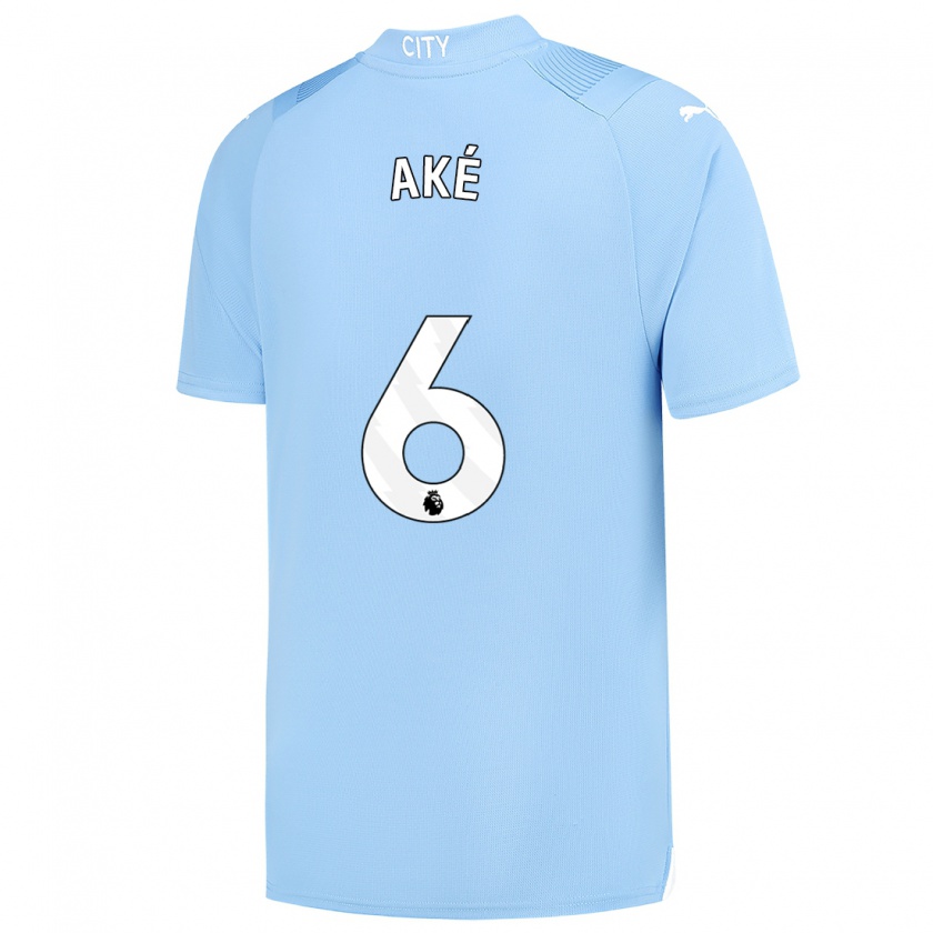 Kandiny Niño Camiseta Nathan Aké #6 Azul Claro 1ª Equipación 2023/24 La Camisa